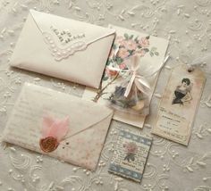 some old fashioned envelopes are laying on a table