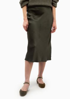 The best-selling Bar Silk Skirt in dark olive is made from 25 mm double-faced silk charmeuse cut on the bias for a smooth silhouette that sits high at the waist and hugs the body through the hips. The high-waisted, midi-length Bar Silk Skirt is cut for a close, streamlined fit. This style features an elasticated waistband for a comfortable, pull-on construction. 100% Silk Dry Clean Only Model is 5’11” and wearing a size M. Runs true to size, we recommend taking your usual size. Model’s Measureme Silk Charmeuse, Silk Skirt, The Body, Midi Length, Dry Clean, High Waisted, Silk, Bar, Skirt