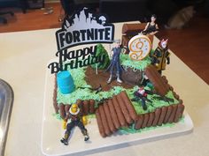 a birthday cake made to look like fortnite