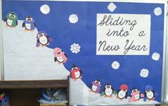 a bulletin board with penguins and snowflakes on it that says sledding into a new year