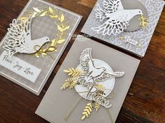 three handmade greeting cards with doves and leaves on them, one is white and the other has gold foil