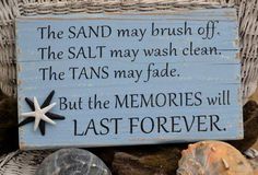 a wooden sign that says, the sand may brush off the salt may wash clean the tans may fade but the memories will last forever