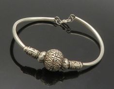 "925 Sterling Silver - Vintage Floral Patterned Bead Bangle Bracelet - BT6547  925 Sterling Silver - Vintage Floral Patterned Bead Bangle Bracelet - BT6547  Jewelry Type:         Bracelet   Metal Type:            925 Silver  Metal Size:             6\"  Stone Type:            N/A  Condition:              N/A  Jewelry Weight:     5.9 Grams  PLEASE NOTE: THIS ITEM IS PRE-OWNED. ALTHOUGH MOST ITEMS ARE IN VERY GOOD CONDITION, SOME MAY NEED CLEANING AND/OR MINOR REPAIRS. WE MAKE A VERY STRONG EFFORT TO UPLOAD CLEAR PICTURES. PLEASE INSPECT ALL PICTURES AND ASK ALL QUESTIONS YOU MAY HAVE PRIOR TO MAKING A PURCHASE. NOT ALL STONES ARE GENUINE, SOME ARE ENHANCED OR CREATED." Elegant Silver Engraved Beaded Bracelets, Elegant Engraved Silver Beaded Bracelets, Elegant Silver Beads Bangle As A Gift, Classic Handmade Beaded Bracelets, Handmade Classic Beaded Bracelets, Silver Engraved Round Beads Bracelet, Silver Engraved Round Bead Bracelets, Beaded Bangles Bracelets, Bracelet Metal