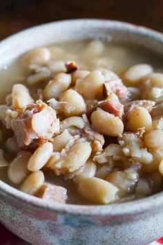 a white bowl filled with food on top of a table