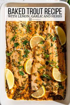 baked lemon garlic and herb salmon in a white casserole dish with text overlay