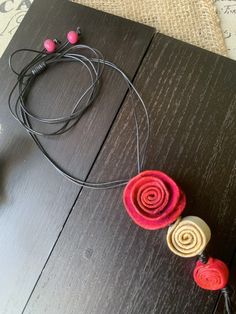 "EXTRA LONG HOT PINK ROSE NECKLACE MADE OF ORANGE PEEL This Unique Eco friendly necklace, features hot pink and beige roses made of Orange peel. These pieces have an incredible natural aroma. This necklace is versatile and will add elegance to any outfit. The straps are made of waxed cotton cord, it's completely adjustable so you can wear it as a chocker or just layer it to your desired length. Necklace total length: 48\" Pendant size: 1.5\" This jewelry has proudly been made in Colombia. By sho Dainty Rose Necklace, Beige Roses, Eco Friendly Necklace, Floral Choker, Rose Pendant Necklace, Dainty Rose, Beaded Bib Necklace, Red And White Roses, Hot Pink Roses