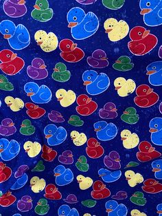 a blue background with colorful rubber ducks on it