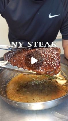 a man sitting at a table with a plate of food in front of him and the words ny steak on it