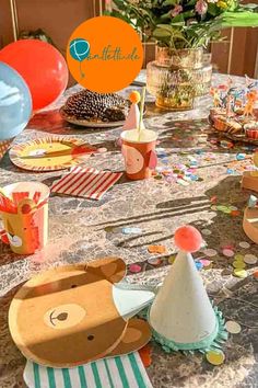 a table topped with lots of party supplies