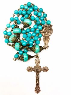 "TRUE BRONZE & GENUINE SINKIANG TURQUOISE ROSARY: 21 Inches Long Your beautiful rosary is made to last a lifetime and become an heirloom for your family. It will come nicely packaged in an organza pouch with a \"How To Pray The Rosary\" pamphlet included. Please remember to have your priest bless your rosary. Materials Used: Genuine Sinkiang Turquoise 6mm Beads, 12mm Turquoise Jasper Rondelle Beads as Paters, True Bronze 2 Inch Crucifix, True Bronze 1.75 Inch Mother Mary/Immaculate Heart Cen Mary Immaculate, Praying The Rosary, Lucky Stone, Rosary Catholic, Genuine Turquoise, Prayer Beads, Bead Caps, Turquoise Beads, Rosary