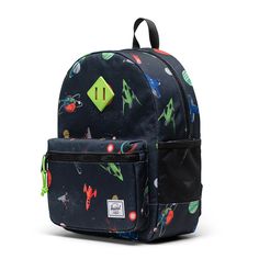 Make their first backpack a great one. The Herschel Heritage Kids Backpack is made from recycled EcoSystem fabrics and sized for school and play, this is our go-to backpack for young adventurers. Herschel Heritage Kids Backpack Details: Sized for 3 - 7 years old EcoSystem 600D Fabric Made from 100% recycled post-consumer water bottles Wipeable front, bottom, and side panel liner Signature diamond detail Zippered closures with Prusik cord pulls Carry comfortably with padded shoulder straps Remova Blue Camping Backpack, Blue Adventure Backpack Standard Shape, Blue Adventure Backpack, Back To School Adventure Backpack, Back To School Nylon Backpack For Adventure, Nylon Backpack For Adventure And Back To School, Back To School Adventure Backpack In Nylon, Playful Backpack For End Of School Year Outdoor Use, Green Standard Backpack