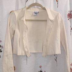 Cream Cropped Cardigan With Collar And Buttons. Never Worn. 95% Cotton Spring Collared Cardigan For Layering, Collared Cardigan For Spring Day Out, Collared Spring Cardigan For Day Out, Spring Collared Cardigan For Day Out, White Collared Cotton Cardigan, Trendy Fitted Cream Cardigan, Cream Button-up Cardigan For Spring, White Button-up Cardigan For Layering, White Collared Cardigan For Fall