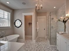 a bathroom with a tub, sink, and shower in the middle of it's walls