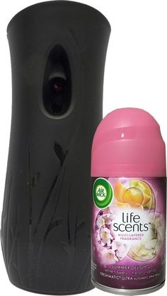 a bottle of deodorant next to a black vase