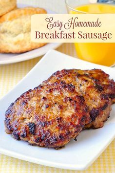 two meat patties on a white plate with orange juice and bread in the background