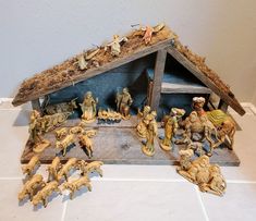 a nativity scene with figurines and animals