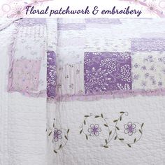 an image of a quilted bed with flowers on it and the words floral patchwork & embroiderry