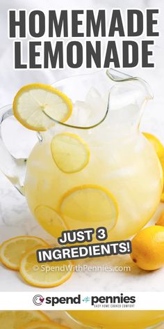 a pitcher filled with lemonade next to sliced lemons