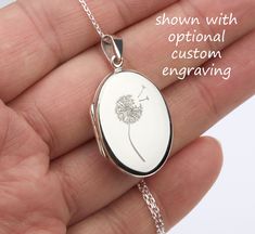 A customizable sterling silver photo locket necklace: 1.  a highly polished solid oval sterling silver oval locket (20 x 27 mm, 5.0 grams). Its front and back can be engraved with text or simple graphics (examples shown in charts).  2. It has two photo slots inside. Photo insertion service is available (selected from the pulldown, notice the price difference). If you select this service, please send your locket photos by attaching them to a conversation to me.  3. a sterling silver cable chain w Wedding Locket, Photo Locket Necklace, Oval Locket, Memory Locket, Simple Graphic, Photo Locket, Locket Necklace, Name Necklace, Custom Engraving