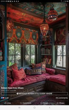 an image of a colorful room with lots of books on the shelves and couches