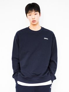 This is a comfortable and casual crewneck sweatshirt that is made out of sturdy cotton and polyester blend fabric. With a minimal yet unique design of graphic print on the back, logo embroidery on the front, and logo emblem embroidered on the left cuff, it gives a casual and trendy look. - Ribbed neckline, cuff, and hem- Graphic print on the back- Graphic logo embroidery on the front- Logo emblem embroidery on the sleeve- Relaxed silhouette Navy Relaxed Fit Crew Sweater, Navy Cotton Crew Neck Sweater, Navy Long Sleeve Sweatshirt With Embroidered Logo, Navy Cotton Sweatshirt For College, Navy Cotton College Sweatshirt, Navy Crew Neck Sweatshirt For Streetwear, Navy Cotton Sweatshirt With Embroidered Logo, Navy Crew Neck Sweater With Embroidered Logo, Navy Casual Crew Sweatshirt