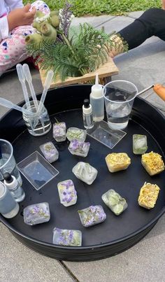 a tray with some ice cubes sitting on top of it next to other items