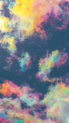 the sky is filled with colorful clouds and stars