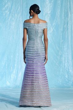 Multi-colored lurex padded maxi gown with hand embroidered gradient-dyed glass yarns.
Component: 1
Pattern: Embroidered
Type Of Work: Hand
Neckline: Off Shoulder
Fabric: Body : Lurex (60% Metallic Fibre 40% Polyester) + Glass Yarns (100% TPU), Lining : Satin (66% Viscose 34% Modal)
Color: Multi Color
Other Details: 
Closure : Centre back zipper
Occasion: Cocktail - Aza Fashions Elegant Multicolor Sequin Gown, Multicolor Floor-length Evening Gown, Multicolor Maxi Gown For Gala, Multicolor Gown With Fitted Bodice For Evening, Multicolor Evening Gown With Fitted Bodice, Formal Multicolor Floor-length Evening Dress, Multicolor Maxi Evening Dress For Gala, Multicolor Maxi Length Gala Evening Dress, Multicolor Floor-length Evening Dress For Gala