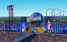 an aerial view of the stage and crowd at a music festival, with roller coasters in the background