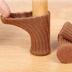 a pair of socks that are next to a wooden pole