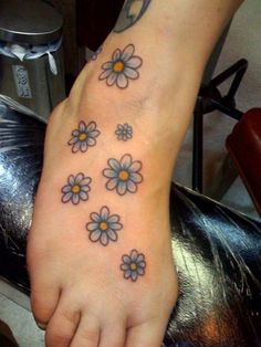 a foot with some flowers on it