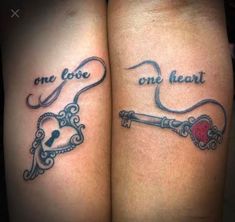 two tattoos that say one love, one heart and the other key to each other