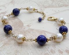 Lapis Lazuli Bracelet, Blue Stone Bracelet, Real Lapis, Pearls, Gold Navy Bracelet, September Births Elegant Pearl Bracelet With Natural Stones For Wedding, Elegant Blue Bracelets With Polished Beads, Elegant Pearl Bracelet With Gemstone Beads For Wedding, Elegant Blue Lapis Lazuli Bracelet, Elegant Lapis Lazuli Jewelry For Anniversary, Elegant Round Pearl Bracelet With Natural Stones, Lapis Lazuli Polished Beads Bracelet, Adjustable Elegant Lapis Lazuli Bracelets, Beaded Lapis Lazuli Bracelet