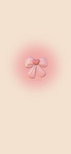 a pink bow with a heart in the center on a beige background that looks like something out of space