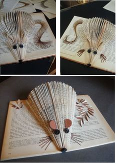 an open book with several pages cut out to look like peacocks