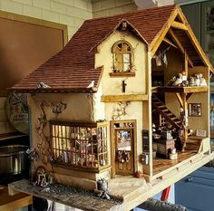 a doll house is sitting on top of a table