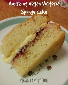 a close up of a piece of cake on a plate with the words amazing vegan victoria sponge cake