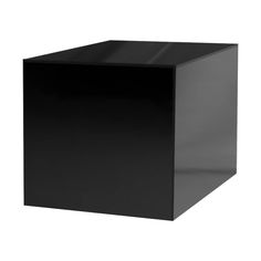 a black square box sitting on top of a white floor