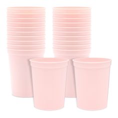 pink plastic cups are stacked on top of each other, with one empty cup in the middle