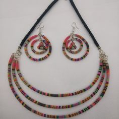 Set Of Earrings, Necklace And Bracelet Woven In A Multicolored Blanket. These Earrings Were Made By Peruvian Artisans From Cusco, Using Ancient Handmade Cloaks With Natural Pigments. These Earrings Are Handmade By Peruvian Artisans From The Andean Community. Fair Trade Multi-strand Festival Jewelry, Multi-strand Fair Trade Festival Jewelry, Multi-strand Fair Trade Jewelry For Festivals, Adjustable Multicolor Dangle Jewelry, Blue Fair Trade Jewelry, Multicolor Handwoven Dangle Jewelry, Multicolor Handmade Multi-strand Jewelry, Handmade Multicolor Multi-strand Jewelry, Fair Trade Multicolor Round Bead Jewelry