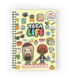 a spiral notebook with stickers on it