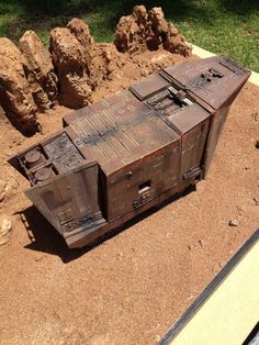 an old trunk is sitting in the dirt