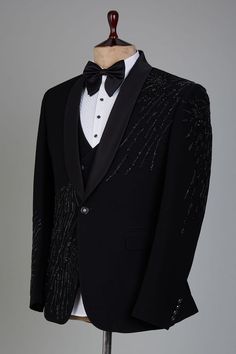 a tuxedo jacket and bow tie on a mannequin