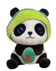 a stuffed panda bear with a green hat on it's head and blue eyes