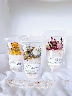 Beth Bath Salt  Bath salt is available in 3 sizes; SMALL - approx. 140g MEDIUM - approx. 250g LARGE - approx.400g  Choose your bath salt ; UPLIFT - Epsom bath salt, Himalayan salt, bergamot essential oil, sweet almond oil, dried calendula flowers, citrine crystal UNWIND - Epsom bath salt, Himalayan salt, a blend of lavender, ylang-ylang, camomile essential oils sweet almond oil, lavender and chamomile dried flowers, moonstone crystal WORRIES AWAY - Epsom bath salt, Himalayan salt lavender, berga Bath Salt Packing Ideas, Epsom Salt For Bath, Essential Oils Gift Ideas, Diy Ritual Bath Salts, Bath Salt Bar Display, Bath Sachets Diy, Bath Salt Display Ideas, Milk Bath Packaging Ideas, Bath Salts Photography Ideas