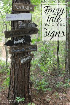 a wooden sign on the side of a tree with arrows pointing to different locations in it