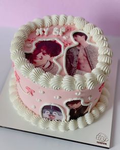 a cake decorated with pictures of two people