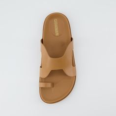 Meet Lover, a footbed slide sandal. Featuring a soft vegan leather upper with a cut-out design, a soft molded footbed, and a lightweight and non-slip traction outsole, these sandals will keep your feet supported and stylish. Leather Footwear, Fashion Footwear, Sandals For Men, Camel Sandals, Mens Sandals Fashion, Fancy Sandals, Leather Slippers For Men, Shoe Makeover, Men Slides