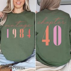 "Classic 1984 Sweatshirts For Women, Vintage 40th Birthday Year Number Sweater For Him, Cute 40th Milestone Best Friend 40 Bday Shirt For Her HOW TO ORDER ➀ Select color ➁ Select the size (Please check size chart) ✦ True to size. Size up 1-2 sizes for an oversized look. ➂ Add to cart ✦ (Optional) \"Add message to Seller\" on the checkout page. GARMENT FEATURES ✦ Crew neckline ✦ Direct to garment printing - no vinyl, decal, or iron-on technique ✦ Our designs are printed on the garment to last a l 40th Birthday Themes, Bday Shirt, Sweatshirts For Women, Garment Industry, Star Shirt, 60th Birthday, Women Vintage, 40th Birthday, Comfort Colors