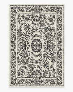 a black and white rug with an intricate design